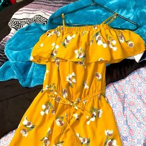 Yellow off the shoulder dress.